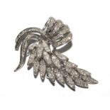 An 18 carat white gold diamond brooch in the form of a leaf