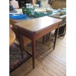 A mahogany fold over tea table, the rectangular top over a plain frieze on square tapering legs,