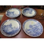 Four Boch Delft chargers, with Dutch landscapes after J. Sonneville, three depicting the same scene,