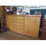 A Skovby light oak sideboard, the five central drawers flanked by cupboard doors, 164 cm wide, 49 cm