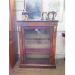 A Victorian inlaid walnut side cabinet, with gilt metal mounts and single glazed door enclosing a