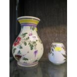 A Delft hand decorated vase with coloured flower decorated, and a small Gouda pottery vase