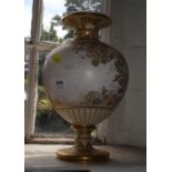 A Doulton Burslem baluster vase, the blush ground with gilt highlights depicting flowers, 29.5 cm