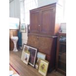 An early 19th century mahogany secretaire cabinet, the pair of panelled doors enclosing adjustable