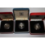 Three Queen Elizabeth II silver proof £1 coins