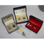 Two pairs of silver cufflinks, Birmingham 1940 and 1954, together with a pair gold plated and