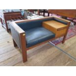 A 1970s teak telephone table and seat, with drop down compartment, 105 cm wide