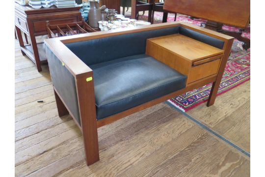 A 1970s teak telephone table and seat, with drop down compartment, 105 cm wide