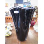 A large black glass linen fold vase, 45 cm high