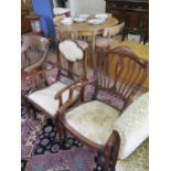 An Edwardian inlaid mahogany open armchair, the rail back with husk inlay, on patera inlaid square