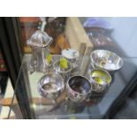 Small silver table wares including a pepperette, a lidded mustard pot, and three salts (7)