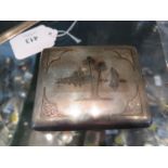A white metal cigarette case decorated with Middle Eastern scenes