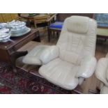 A Daneway cream leather reclining and swivel armchair and footstool