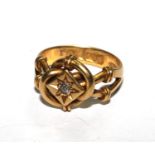 An 18 carat gold ring with an entwined design set with a diamond