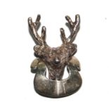 A silver brooch in the form of a stag's head