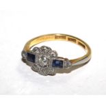 An Art Deco gold coloured ring set with diamonds and two rectangular sapphires