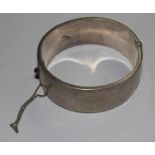 A silver and gold bangle