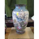 A Japanese cloisonne vase, depicting birds in flowering trees, on a pink ground, with damage, 33.5