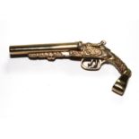 A gold colour metal model of a shotgun