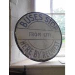 A painted metal request bus stop sign, 51 cm diameter