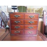 A Chinese brass bound jewellery cabinet, with four long drawers imitating short drawers, silk