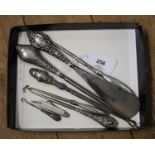 Six silver handled button hooks, a mother of pearl folding button hook and a silver handled shoe