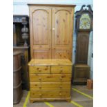 A pine twin door wardrobe, 97 cm wide, 54cm deep, 184 cm high, and a similar chest of two short