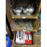 Three trays of silver plate comprising a three piece tea set, a silver plated oval tray and two