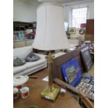 A brass column table lamp, with reeded column on a stepped square base with pad feet, 48 cm high