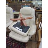 A Daneway cream leather reclining and swivel armchair and footstool