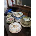 A large collection of decorative plates, including Wedgwood David Shepherd Collection, Royal Doulton