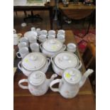 A Denby stoneware Encore pattern off-white and floral table service, including tea and coffee pots,