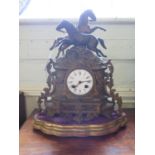 A French 19th century gilt spelter mantel clock, the two prancing horses over an enamelled dial