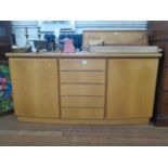 A Skovby light oak sideboard, the five central drawers flanked by cupboard doors, 164 cm wide, 49 cm
