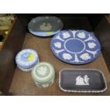 A pair of Wedgwood Jasperware trinket boxes, one with grapevine design, together with two plates and