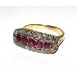 A ruby and diamond set gold ring (one stone damaged)