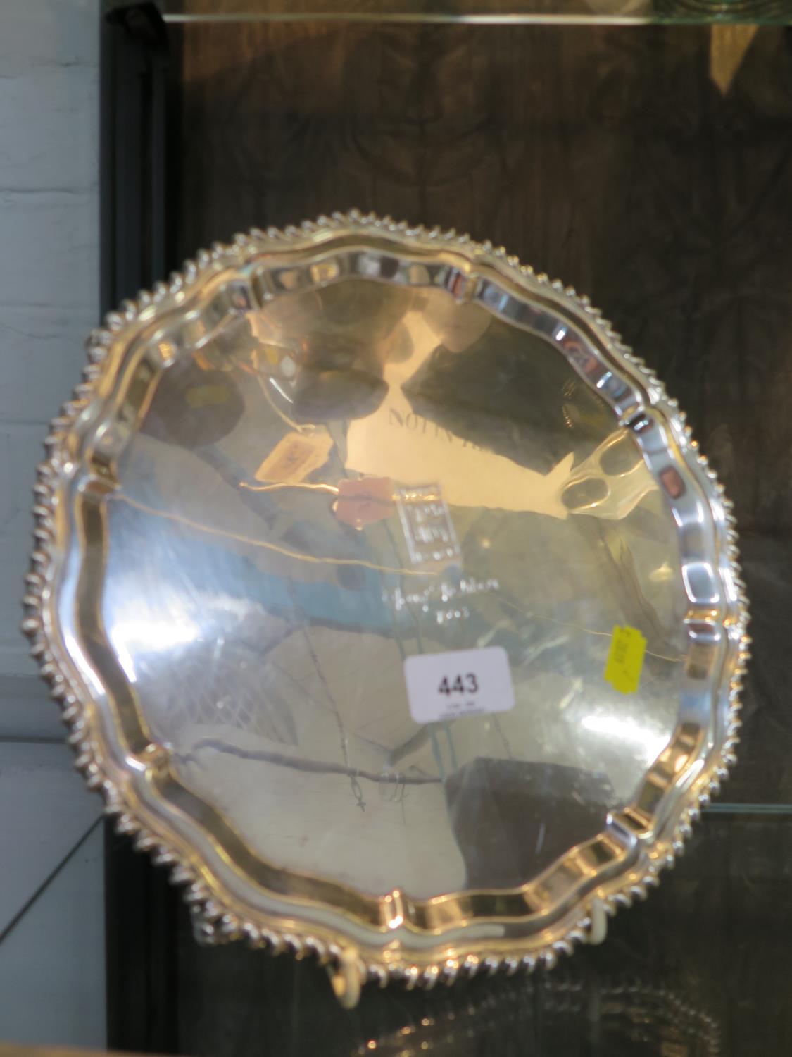 A silver salver, with gardooned pir-crust edge, the centre engraved with a Rolls Royce logo, a