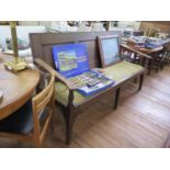 A 19th century oak settle, the triple panelled back over a later upholstered seat, on square