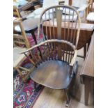 An Ercol stained ash Windsor type rocking chair
