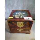 A Chinese lacquer jewellery box, the hinged lid with cork scene of cranes flying over a pagoda,