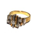 A 1970s 18 carat gold ring set with five diamonds surmounting yellow and white gold posts