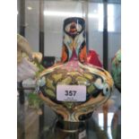 A Moorcroft Pottery baluster vase, with artichoke and bee design, marked on the base Trial 15-9-