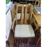 A set of six teak dining chairs by Nathan, including two carvers, with open splat backs, and a