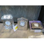 A Carrs of Sheffield silver bedside clock, 2000, and a Wedgwood crystal clock and another silver