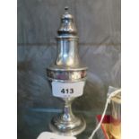 A silver sugar caster