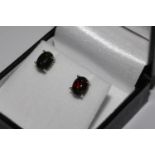 Pair oval black opal studs set in silver