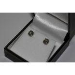Pair 18ct white gold four claw RBC solitaire diamond studs. 1.57ct total. Boxed