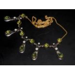 A Necklace set with polished peridot and diamonds. Boxed