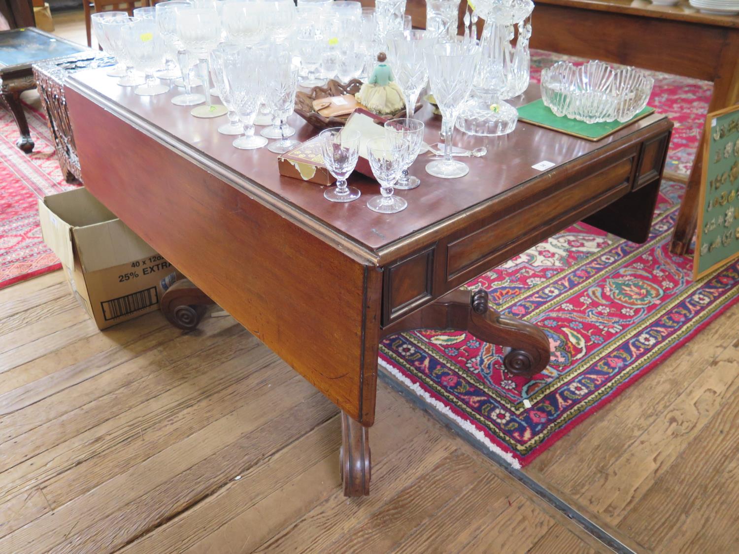 A William IV mahogany Pembroke table, with cushion moulded frieze and drawer on a square waisted