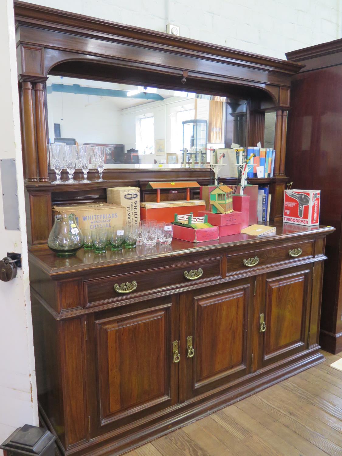 An Edwardian walnut mirror back sideboard, the moulded cornice over twin column supports and